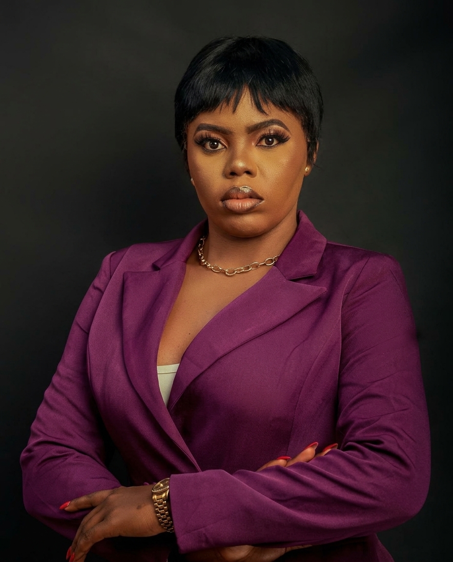 Adejumoke Peggy Adeleye, real estate consultant, in a purple blazer